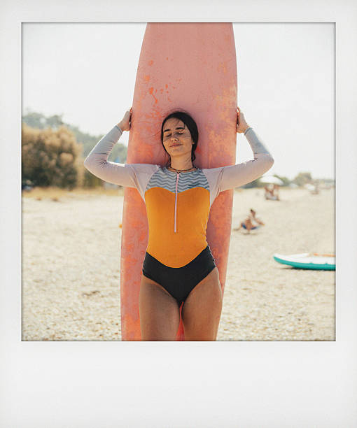 istock Surfer girl and her surfboard 2206879284
