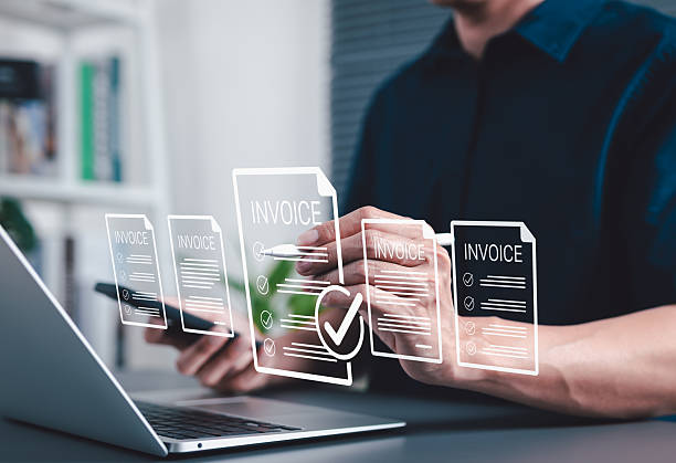 istock Digital E-Invoice and Billing Management Concept. Businessman using laptop and pen with invoice documents, representing electronic invoicing and digital billing systems. invoice for payment, receipt, 2206879547