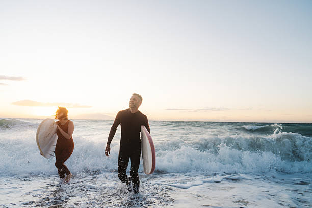 istock Couple of surfers 2206879784