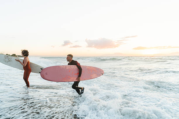istock Couple of surfers 2206879836
