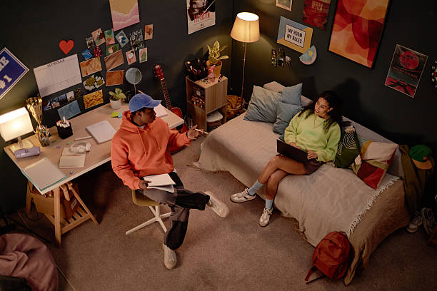 istock Teens Studying and Discussing in Cozy Dorm Room 2206880393