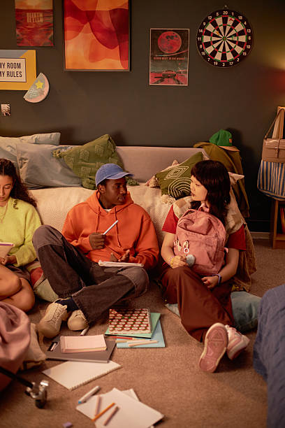 istock Enjoying Time in Cozy Dorm Room with Friends 2206880450