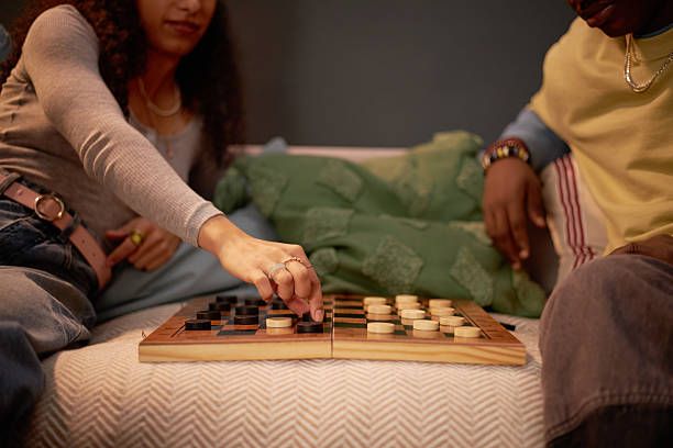 istock Playing Chess on Wooden Board in Cozy Home Setting 2206880476