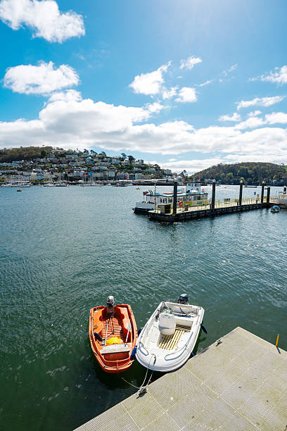 istock Two boats moored at dartmouth waterfront on sunny day 2206882306