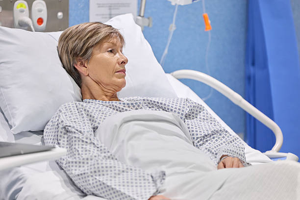 istock Thoughtful senior patient lying on gurney 2206883839