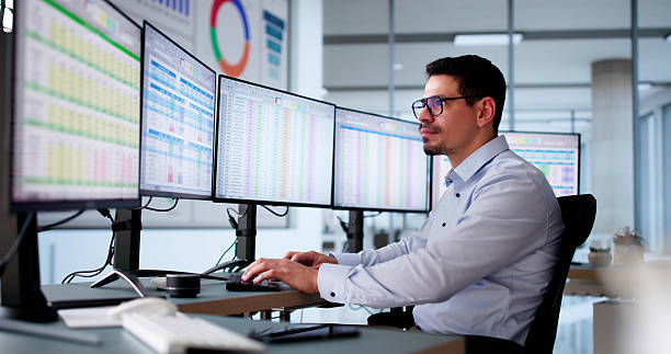 istock Male In The Office Audits Medical Billing Reports. 2206885002