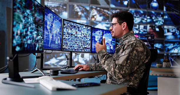 istock Hispanic Surveillance Specialist Monitoring Security Cameras 2206885017