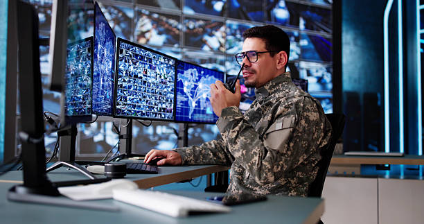 istock Hispanic Surveillance Specialist Monitoring Security Cameras 2206885021