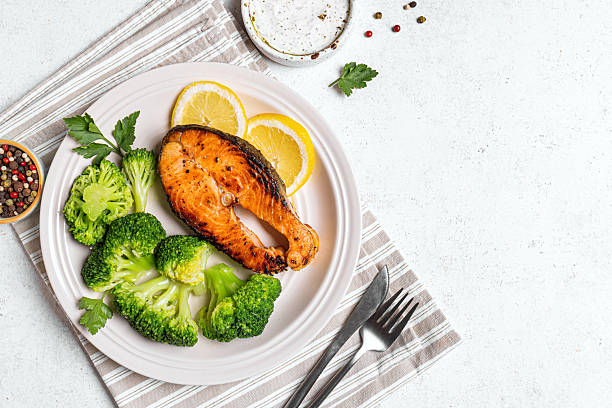 istock Grilled salmon fish steak with steamed vegetables 2206885721