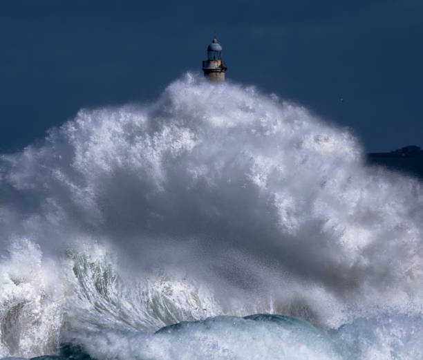 istock A huge wave splashes on the Mouro lighthouse 2206885758