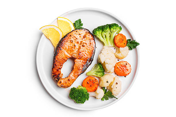 istock Grilled Salmon Steak and Steamed Vegetables 2206885972