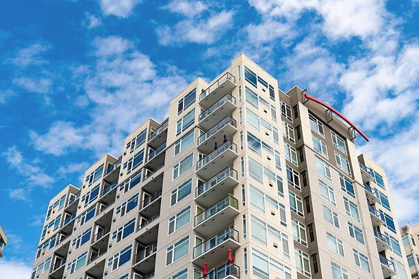 istock Building perspective view. Condominium architecture. Architecture of residential building. Residential house. Modern condominium building. Architectural building in neighborhood. Rent apartment 2206887010