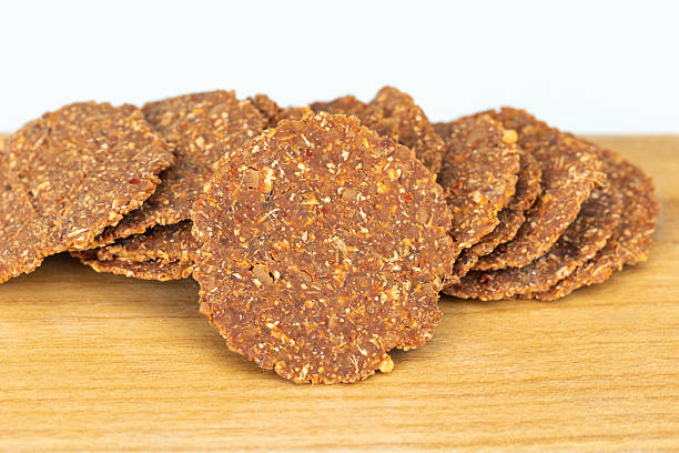 istock Fermented soybean sheets on wooden plate on white background. 2206887303