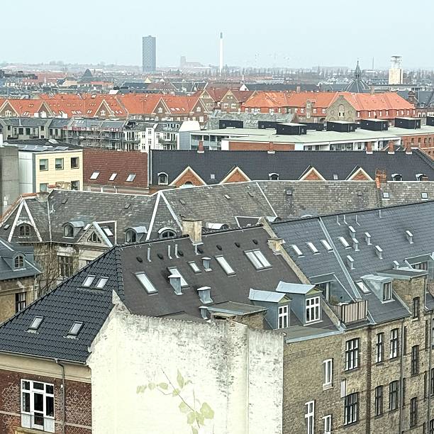 A stunning high-angle view of Copenhagen, Denmark, taken from Codanhus in Vesterbro on March 25, 2025. This captivating image highlights the city's diverse architecture, blending historic and modern buildings, and showcases the dynamic urban landscape from a real estate perspective. The vibrant rooftops, city streets, and iconic structures offer a compelling look at Copenhagen’s architectural charm and metropolitan appeal.