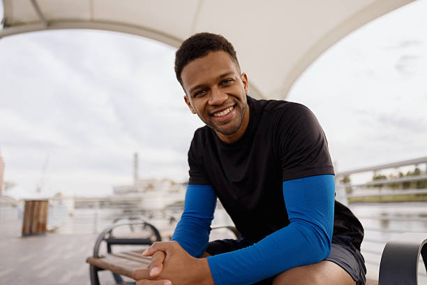 istock Smiling black athlete resting after training outdoors 2206889946