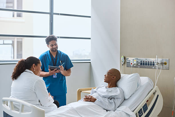 istock Smiling cancer patient discussing with medical team 2206890547