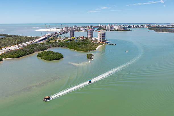 Drone angle view of resorts on Lovers Key in Fort Myers, Florida with Estero Island in the background.