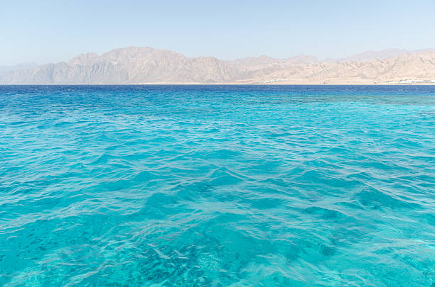 istock Vibrant Red Sea waters with mountainous horizon 2206895538