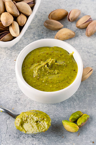 istock Delicious pistachio butter on white background 2206896370