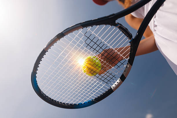 istock young tennis player playing tennis, bottom view 2206896760