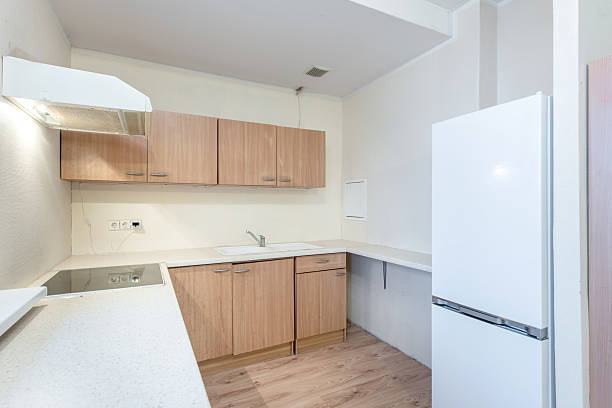 istock Modern Home Minimalist Kitchen Interior with Wood Cabinets and White Refrigerator 2206896859