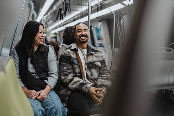 istock Couple riding on subway in San Francisco, California 2206902879