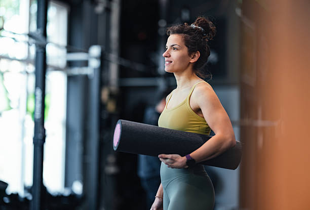 istock Woman Holding Foam Roller at Gym During Workout Session 2206907282