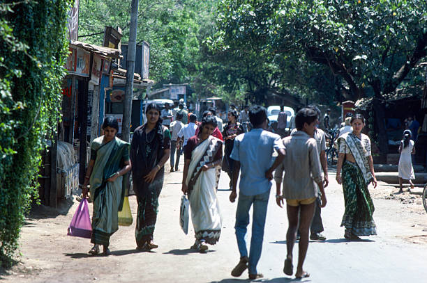 Mumbai, India – March 1, 1986: City Street Scene, crowds walking down the street.