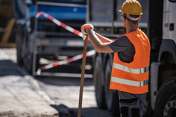 istock Construction worker in safety gear overseeing worksite operations during daylight hours 2206907685