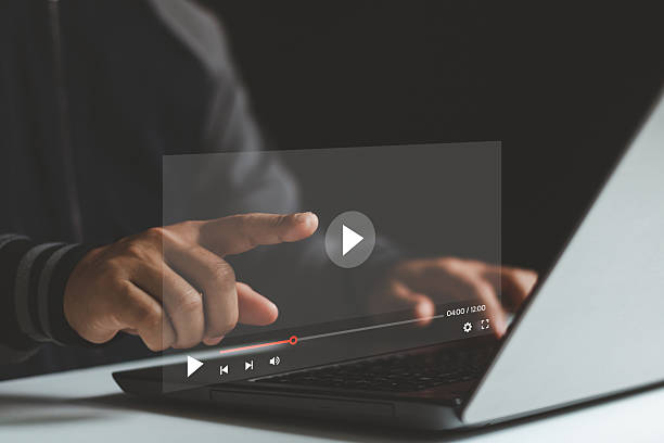 istock Concept about subscription based live digital stream. Video streaming on internet. Man hands using laptop computer for streaming and watching online movie, TV series, live concert, show or tutorial. 2206907803