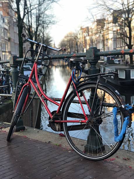 istock Red Bicycle on a Canal Street in Amsterdam 2206908987