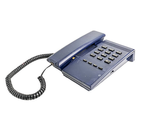 istock dark blue landline telephone with numeric keypad on a white background. 2206913208