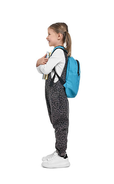 istock Cute schoolgirl with books on white background 2206914469