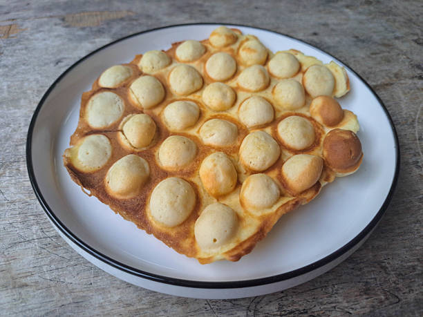 istock Yummy Bubble Waffle Without Topping On A Plate. Dessert Food Menu. 2206914636