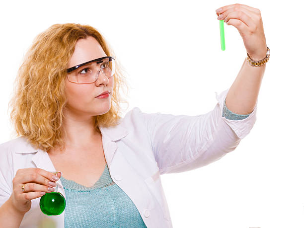 Experiments in laboratory.  Chemist woman or student girl scientific researcher with chemical bottles test flask. Isolated on white