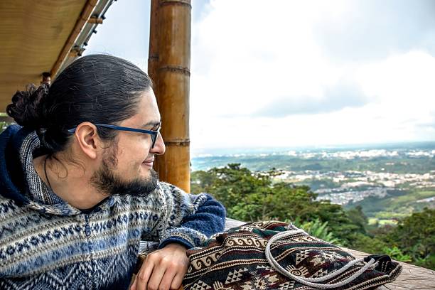 istock Thoughtful man wearing glasses and wool sweater in rustic setting 2206917377
