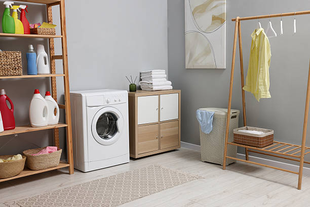 istock Laundry room interior with washing machine and furniture 2206917876