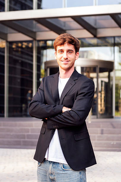 istock man with arms crossed in front of office building 2206918156