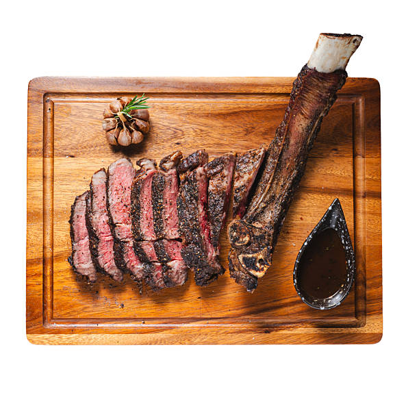 istock Slicing tomahawk steak gourmet food photography in rustic setting 2206919697