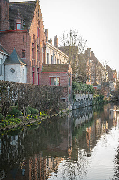 istock Bruges Canals Reflecting Historic Architecture at Sunset 2206921741