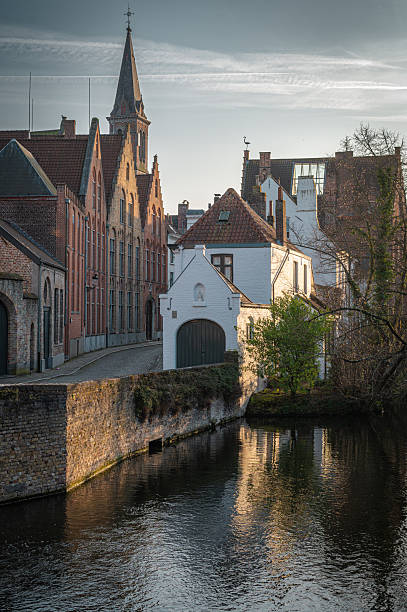 istock Bruges Canals Reflecting Historic Architecture at Sunset 2206922082