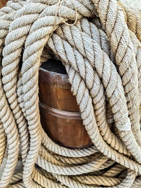 Close up of nautical rope wrapped around a wooden barrel, evoking Iceland's maritime heritage