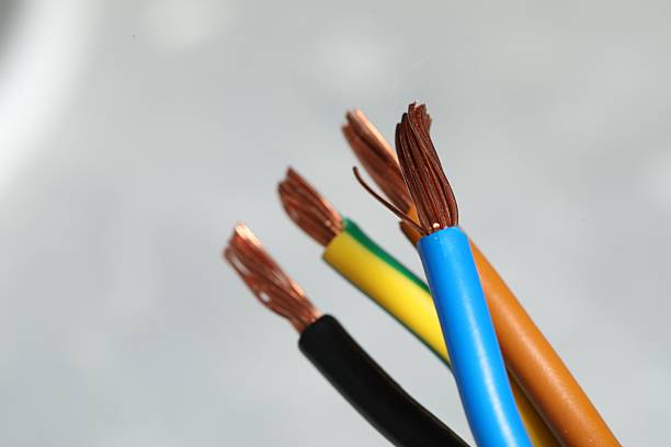 istock Colorful electrical wires on blurred background, closeup. Space for text 2206929778