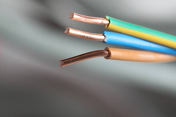 istock Colorful electrical wires on blurred background, closeup. Space for text 2206929797