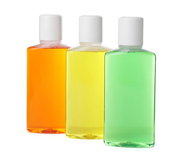 istock Three bottles of mouthwash isolated on white 2206930036
