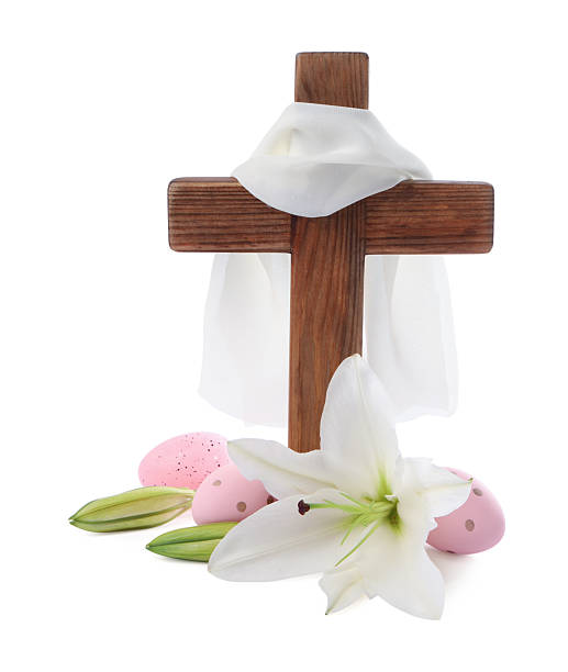 istock Wooden cross, cloth, painted Easter eggs and lily flowers on white background 2206930175
