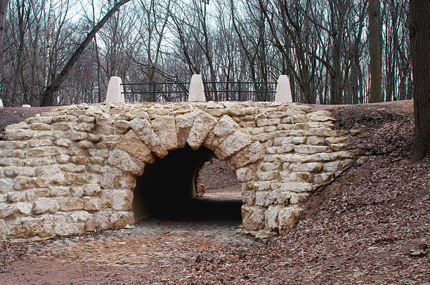 istock Old stone grotto in an autumn park 2206931799