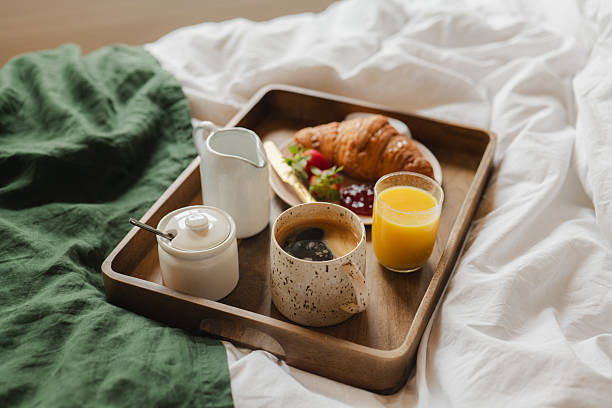 istock Morning Ritual – Pour Over Coffee and Croissant in bed 2206933949