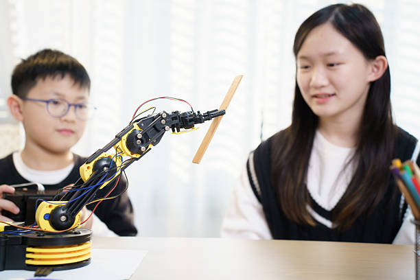 istock Asian boy and girl are learning with STEM toys, STEM is Sciences, Technology, Engineering, and Mathematics. 2206934086