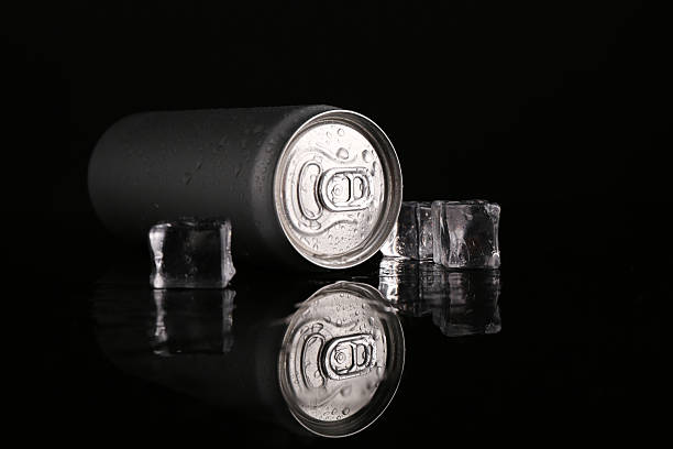 istock Energy drink in wet can and ice cubes on black background 2206940632
